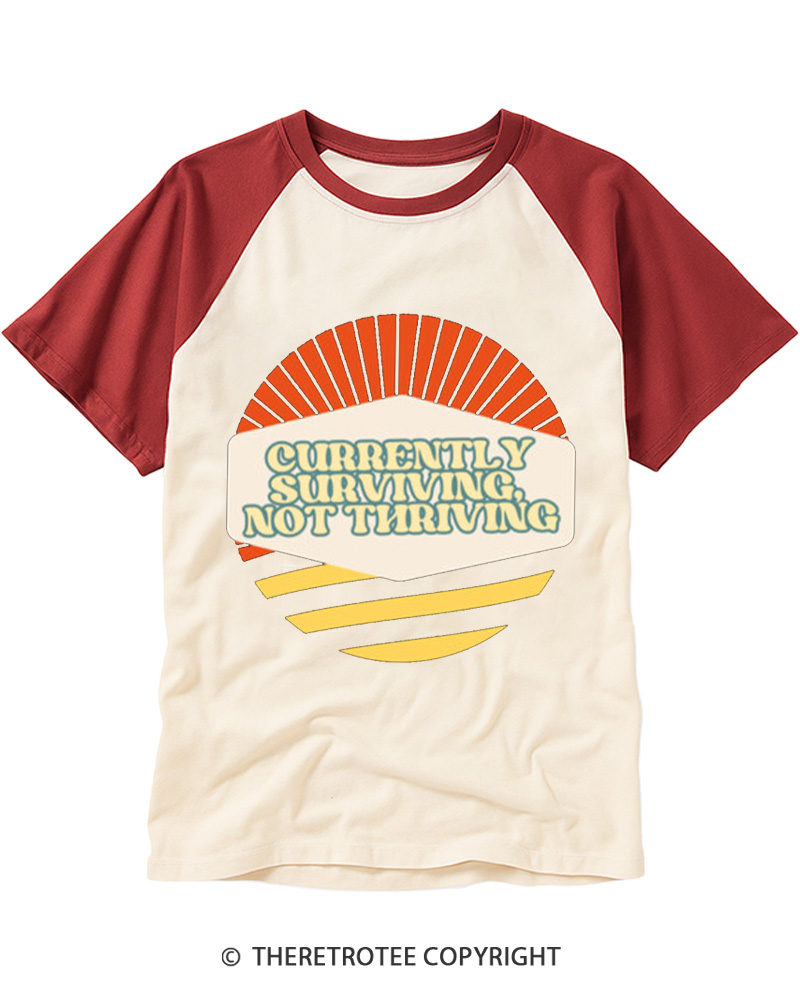 TheRetroTee Currently Surviving Not Thriving Raglan Baseball T-Shirt