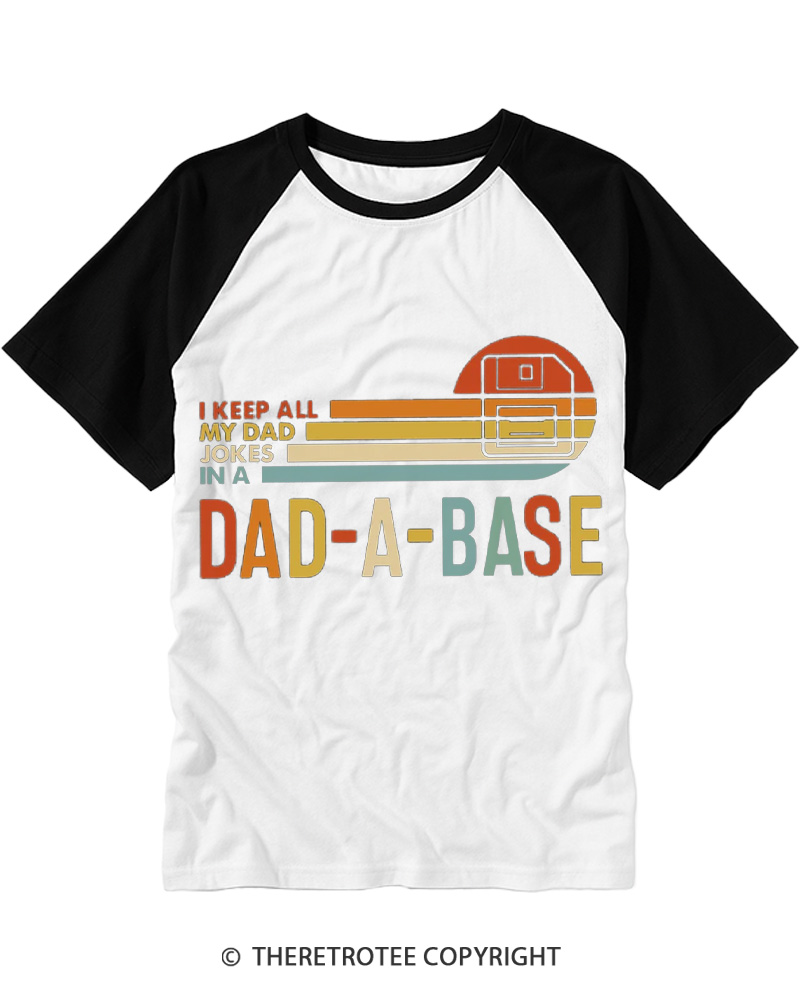 TheRetroTee I Keep All My Dad Jokes In A Dad-a-base 1970s Raglan Baseball T-Shirt