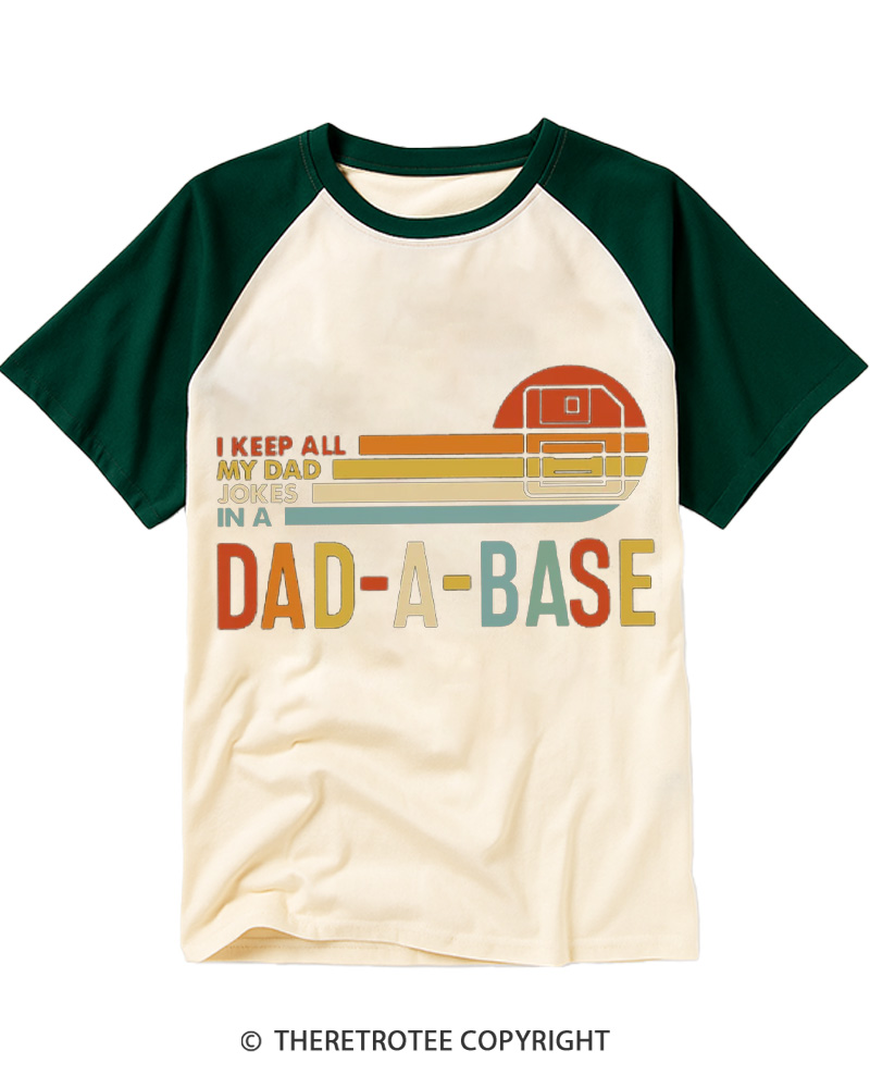 TheRetroTee I Keep All My Dad Jokes In A Dad-a-base 1970s Raglan Baseball T-Shirt