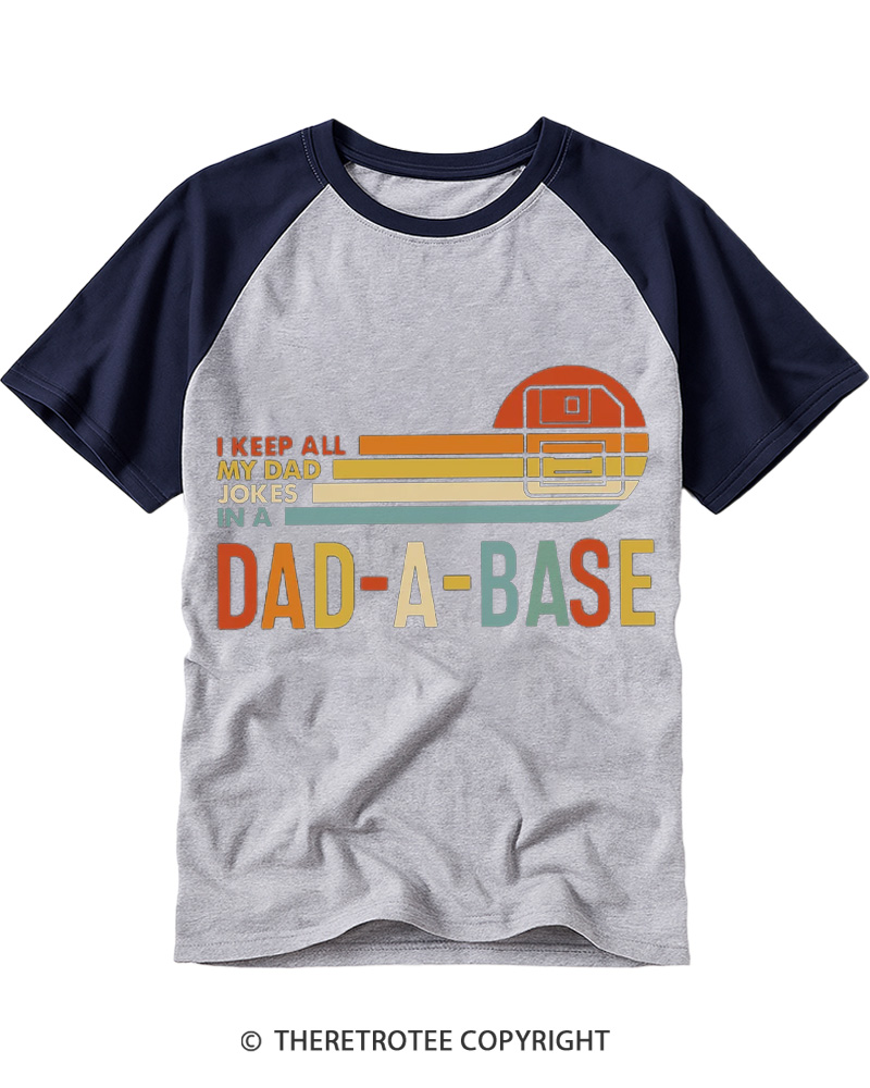 TheRetroTee I Keep All My Dad Jokes In A Dad-a-base 1970s Raglan Baseball T-Shirt