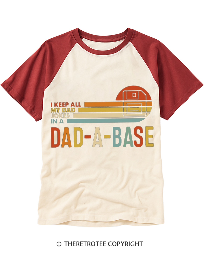TheRetroTee I Keep All My Dad Jokes In A Dad-a-base 1970s Raglan Baseball T-Shirt