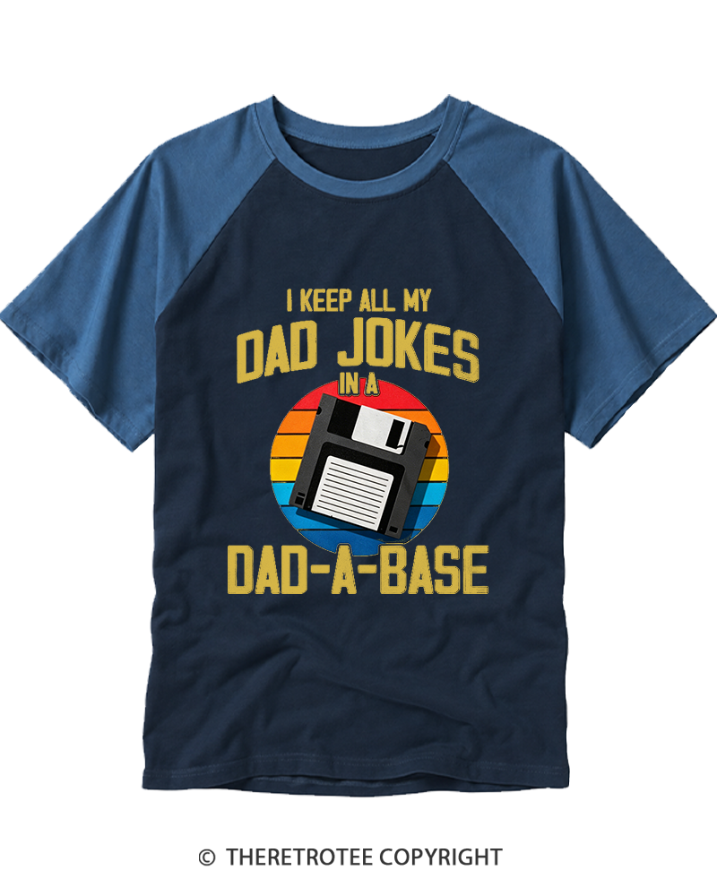TheRetroTee I Keep All My Dad Jokes In A Dad-A-Base  1980s Raglan Baseball T-Shirt