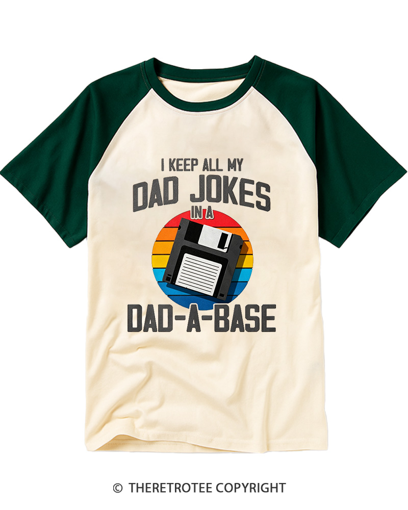 TheRetroTee I Keep All My Dad Jokes In A Dad-A-Base  1980s Raglan Baseball T-Shirt