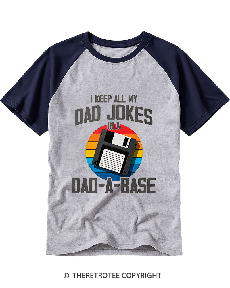 TheRetroTee I Keep All My Dad Jokes In A Dad-A-Base  1980s Raglan Baseball T-Shirt