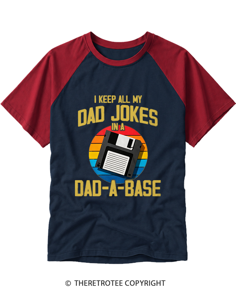 TheRetroTee I Keep All My Dad Jokes In A Dad-A-Base  1980s Raglan Baseball T-Shirt