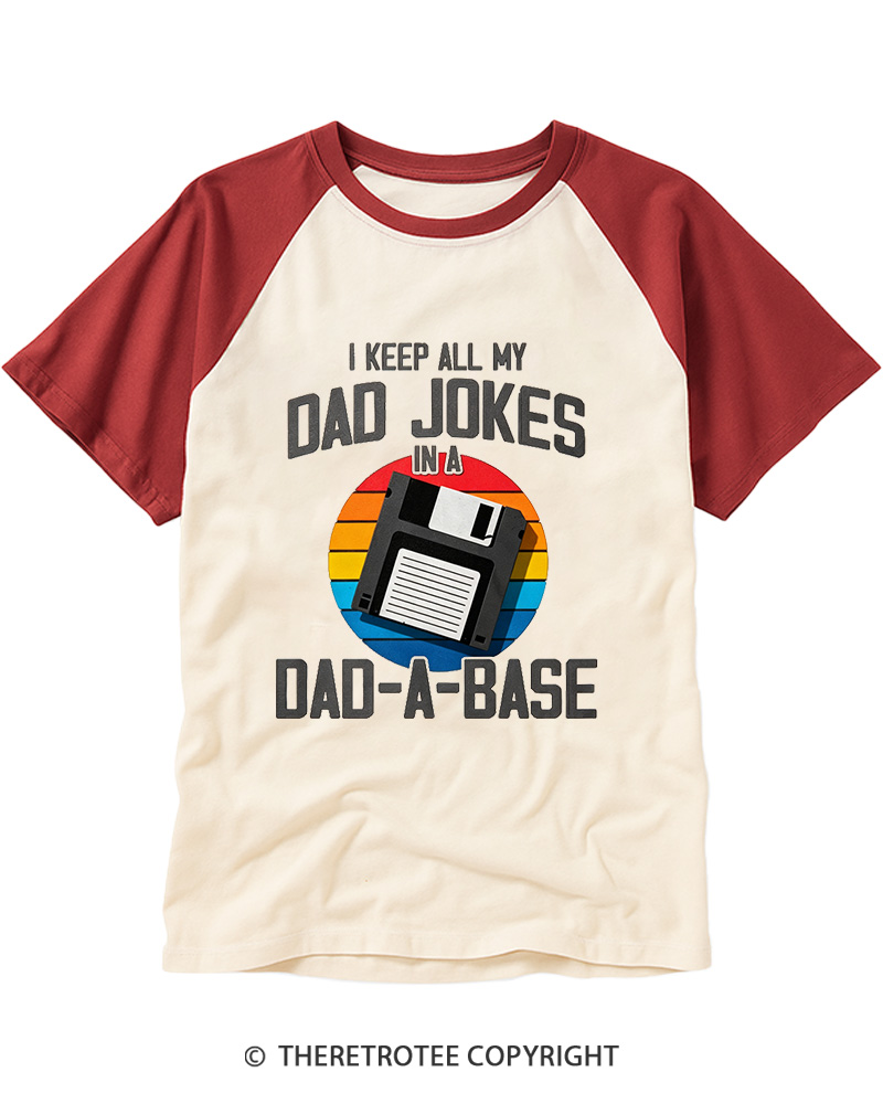 TheRetroTee I Keep All My Dad Jokes In A Dad-A-Base  1980s Raglan Baseball T-Shirt
