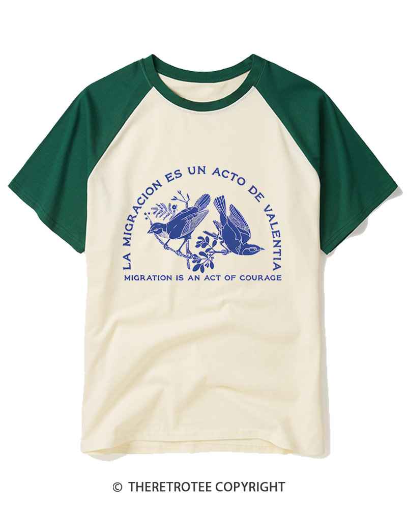 TheRetroTee La Migración Es Un Acto De Valentía Raglan Baseball T-Shirt