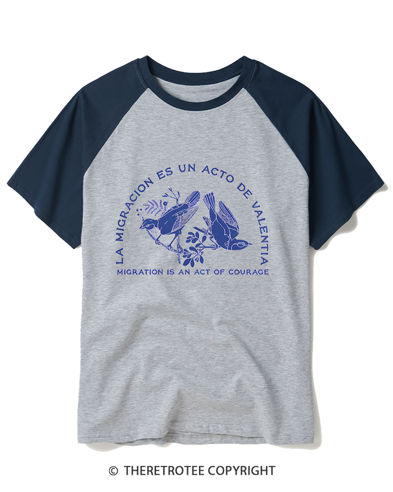 TheRetroTee La Migración Es Un Acto De Valentía Raglan Baseball T-Shirt