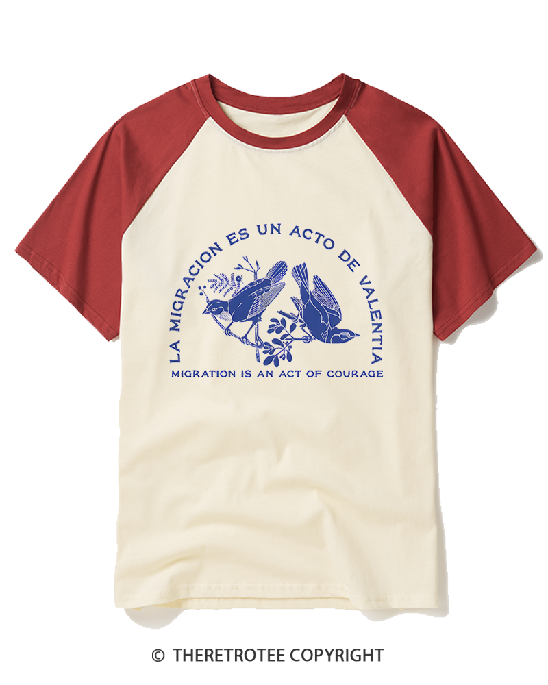 TheRetroTee La Migración Es Un Acto De Valentía Raglan Baseball T-Shirt