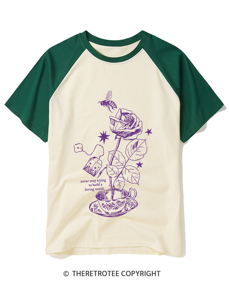 TheRetroTee Never Stop Trying To Build A Loving World 1980s Raglan Baseball T-Shirt