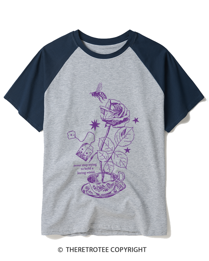 TheRetroTee Never Stop Trying To Build A Loving World 1980s Raglan Baseball T-Shirt