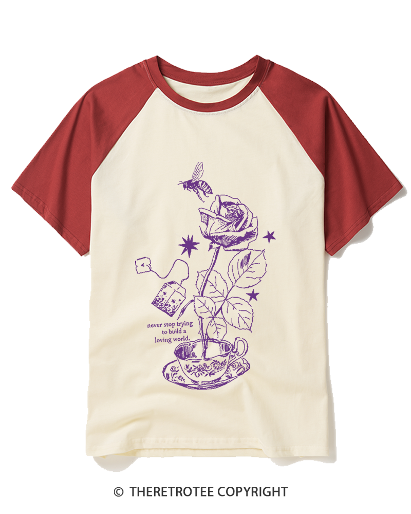 TheRetroTee Never Stop Trying To Build A Loving World 1980s Raglan Baseball T-Shirt
