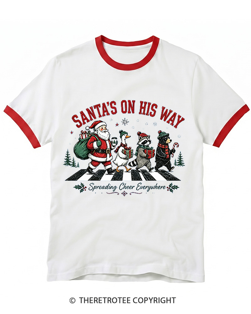 TheRetroTee Santa’s On His Way 1960s Christmas Ringer T-shirt