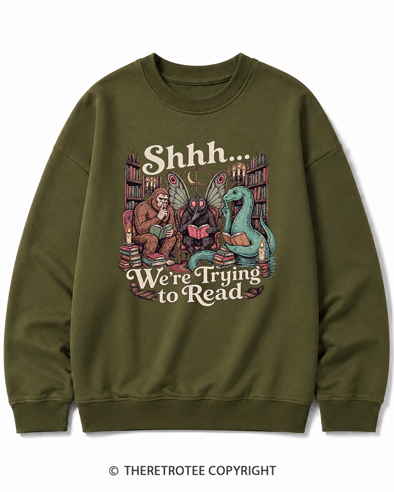 TheRetroTee Shhh We're Trying to Read Cryptid 1970s Halloween Cotton Sweatshirt