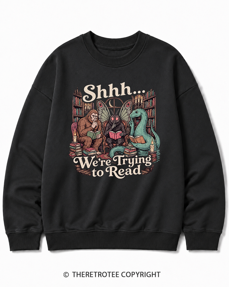 TheRetroTee Shhh We're Trying to Read Cryptid 1970s Halloween Cotton Sweatshirt