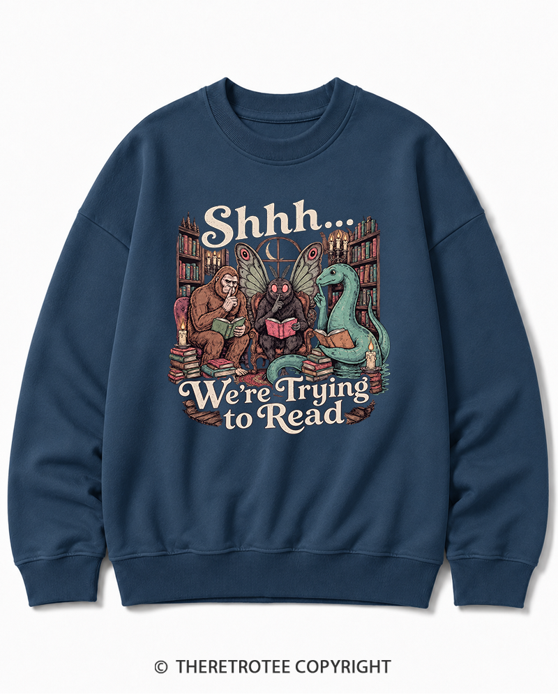 TheRetroTee Shhh We're Trying to Read Cryptid 1970s Halloween Cotton Sweatshirt
