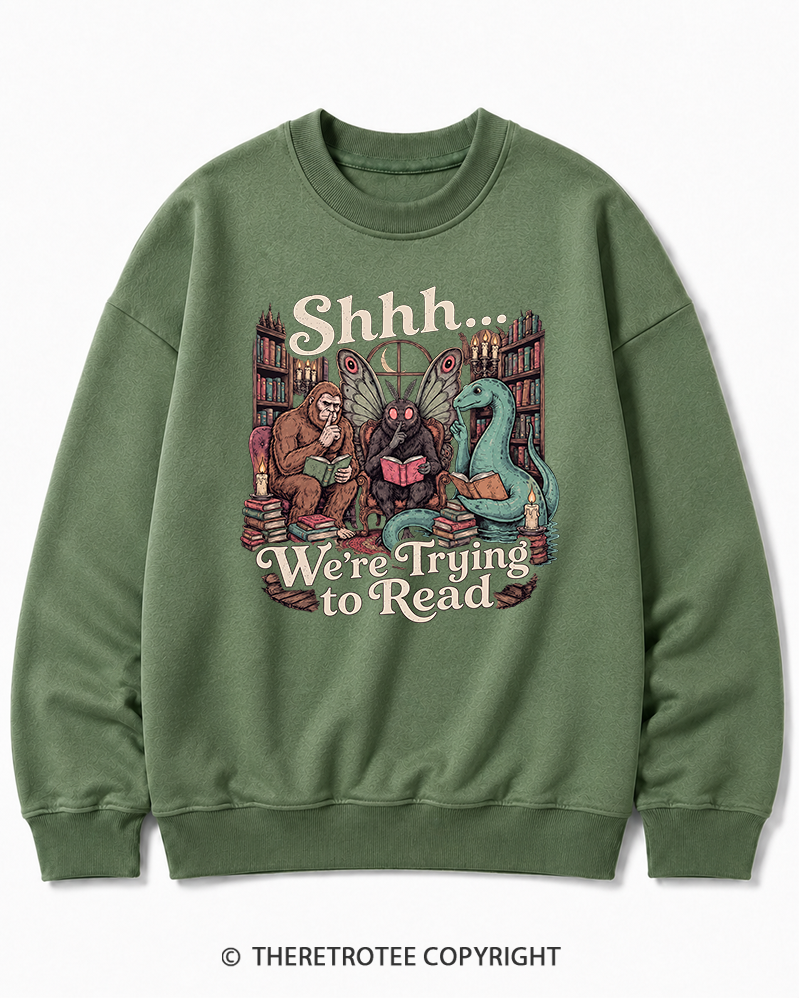 TheRetroTee Shhh We're Trying to Read Cryptid 1970s Halloween Cotton Sweatshirt