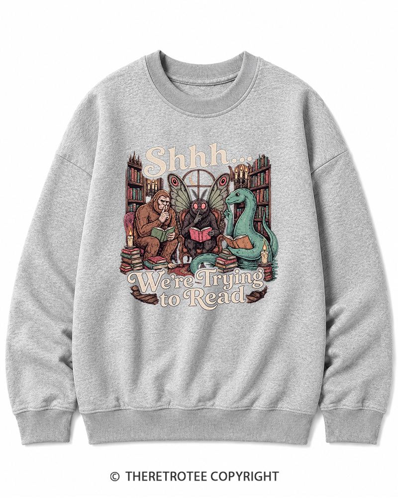 TheRetroTee Shhh We're Trying to Read Cryptid 1970s Halloween Cotton Sweatshirt