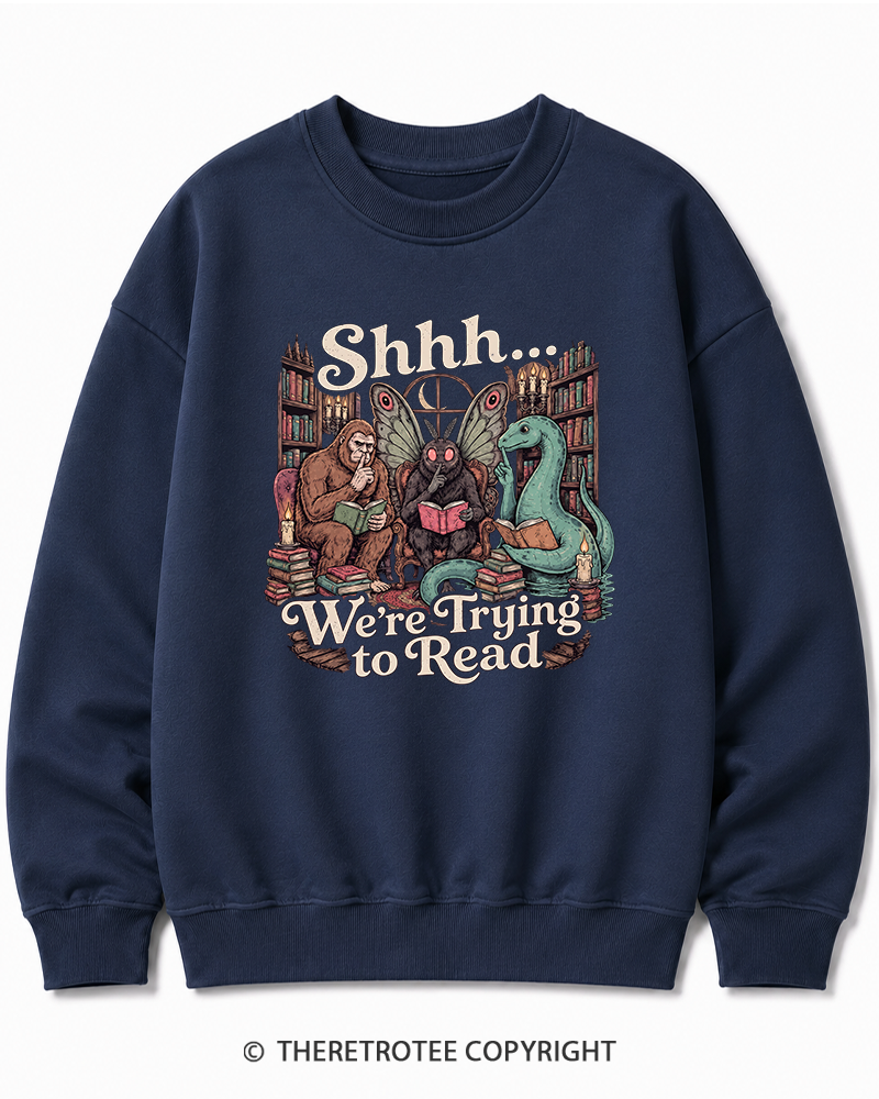 TheRetroTee Shhh We're Trying to Read Cryptid 1970s Halloween Cotton Sweatshirt