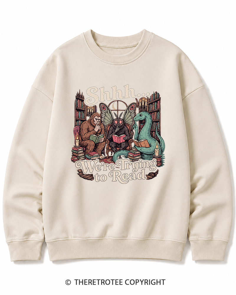 TheRetroTee Shhh We're Trying to Read Cryptid 1970s Halloween Cotton Sweatshirt