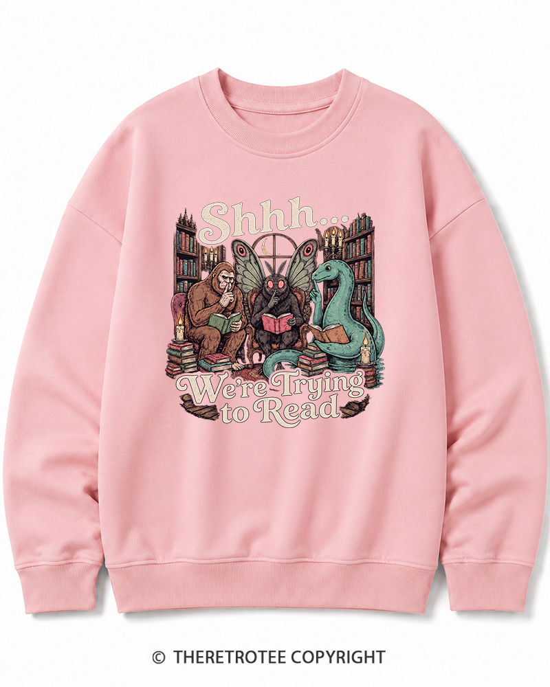 TheRetroTee Shhh We're Trying to Read Cryptid 1970s Halloween Cotton Sweatshirt