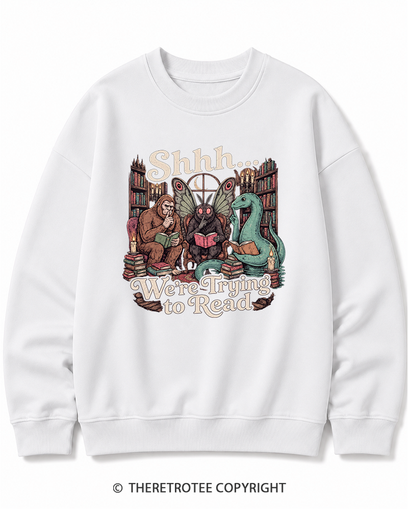 TheRetroTee Shhh We're Trying to Read Cryptid 1970s Halloween Cotton Sweatshirt