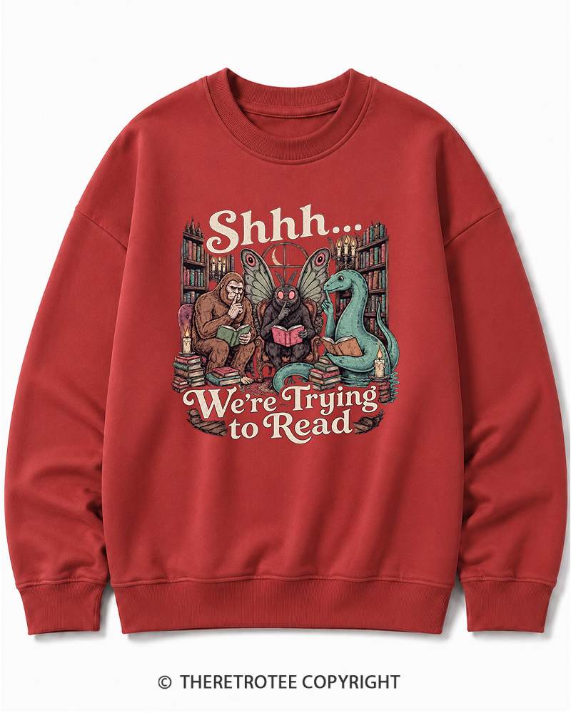 TheRetroTee Shhh We're Trying to Read Cryptid 1970s Halloween Cotton Sweatshirt