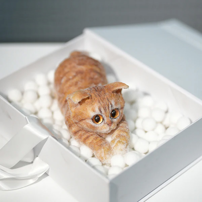 Simulated turmeric cat felt ornament