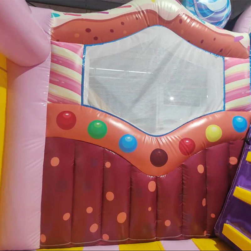 Candy-themed inflatable castle slide