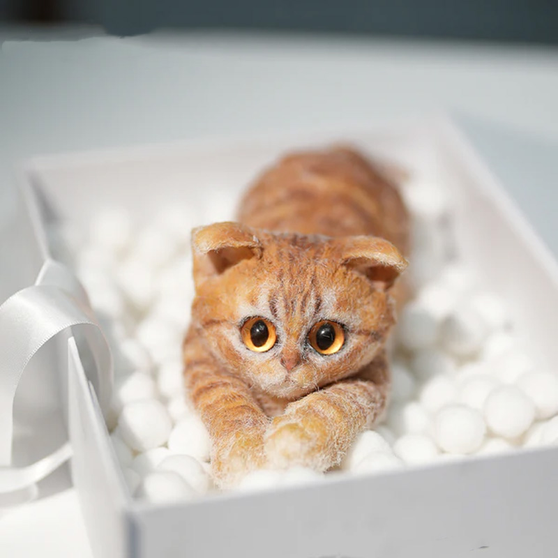 Simulated turmeric cat felt ornament