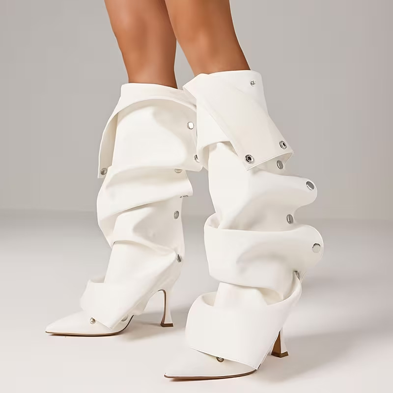 Pointed-toe, effortlessly chic knee-high heels