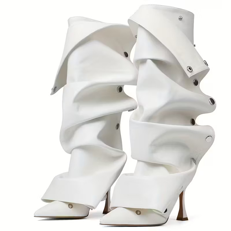 Pointed-toe, effortlessly chic knee-high heels