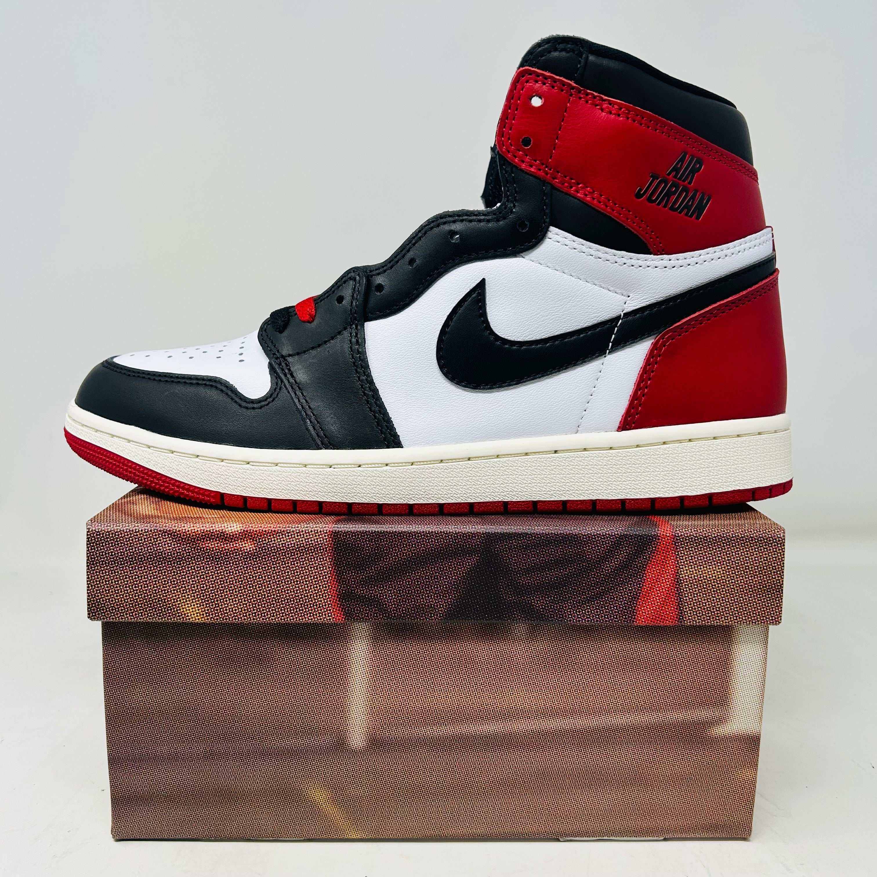 Jordan 1 Retro High OG Black Toe sneaker in red, white, and black on shoebox, 2024 release, brand new and authentic