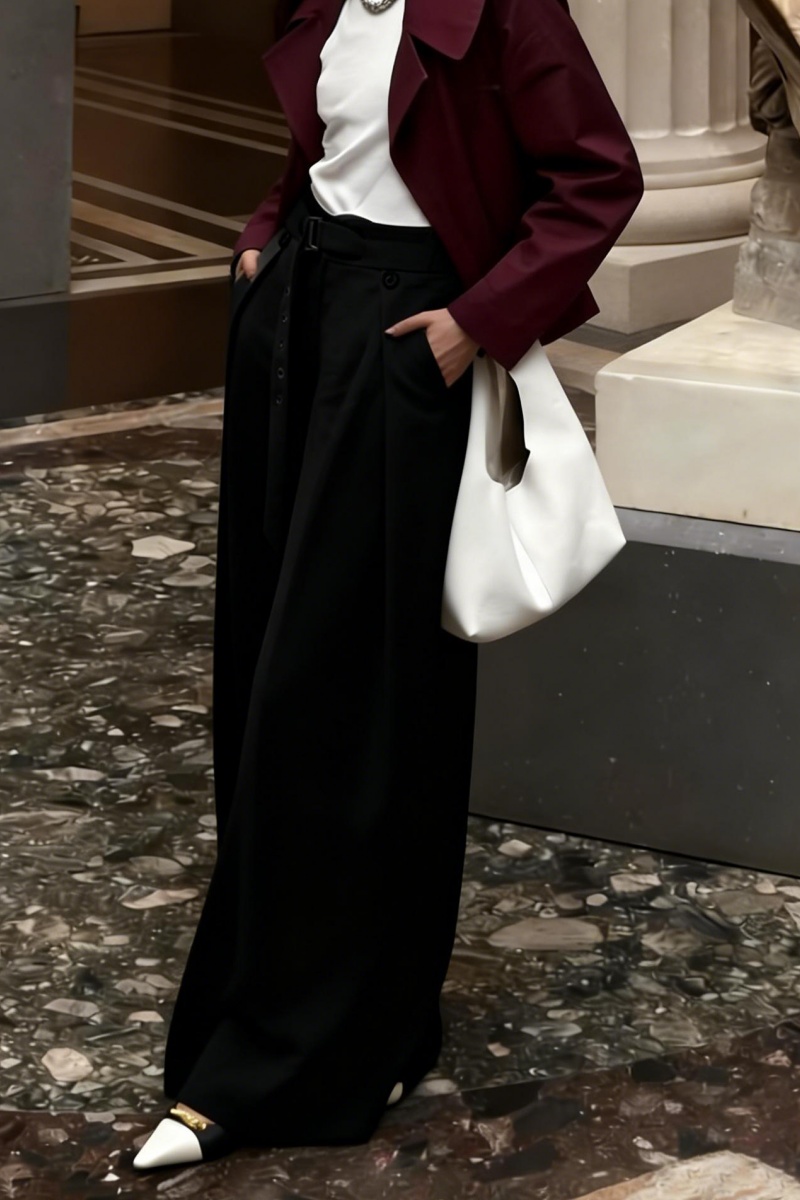 Loose-fitting straight-leg trousers with a three-dimensional pleated, draped waistband.