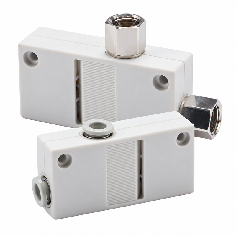 Two clean white ZH series box-type vacuum generators with push-in and female thread connections