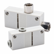 Two clean white ZH series box-type vacuum generators with push-in and female thread connections