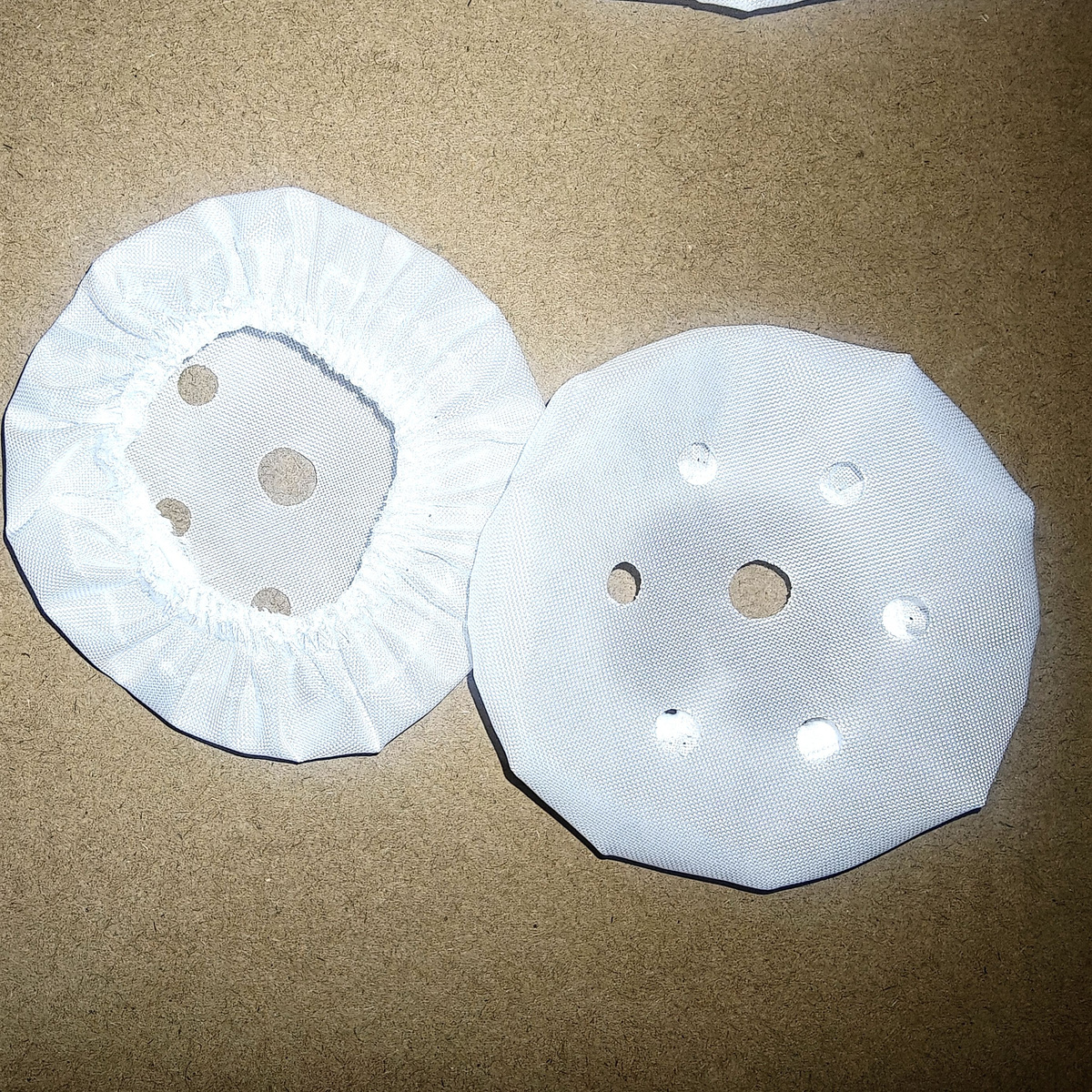 Front and reverse fabric cover pair for vacuum cups