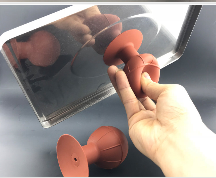 Actual supplied photograph of the orange tool handling a flat glass workpiece