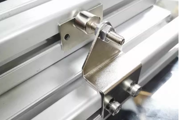 Original Z-shaped catch installation photograph; extrusions and surrounding hardware are not included