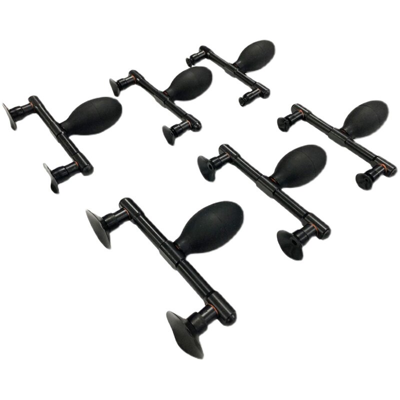 Real black dual-cup vacuum pickup tool family on white background