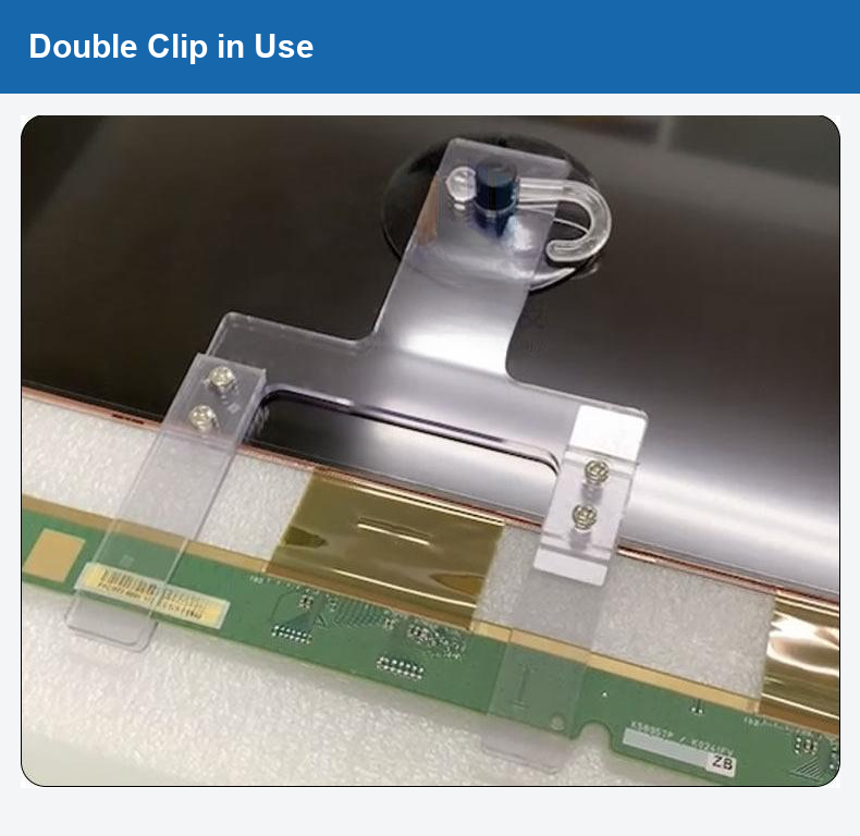 Original close-up of a double clip holding a circuit-board assembly.