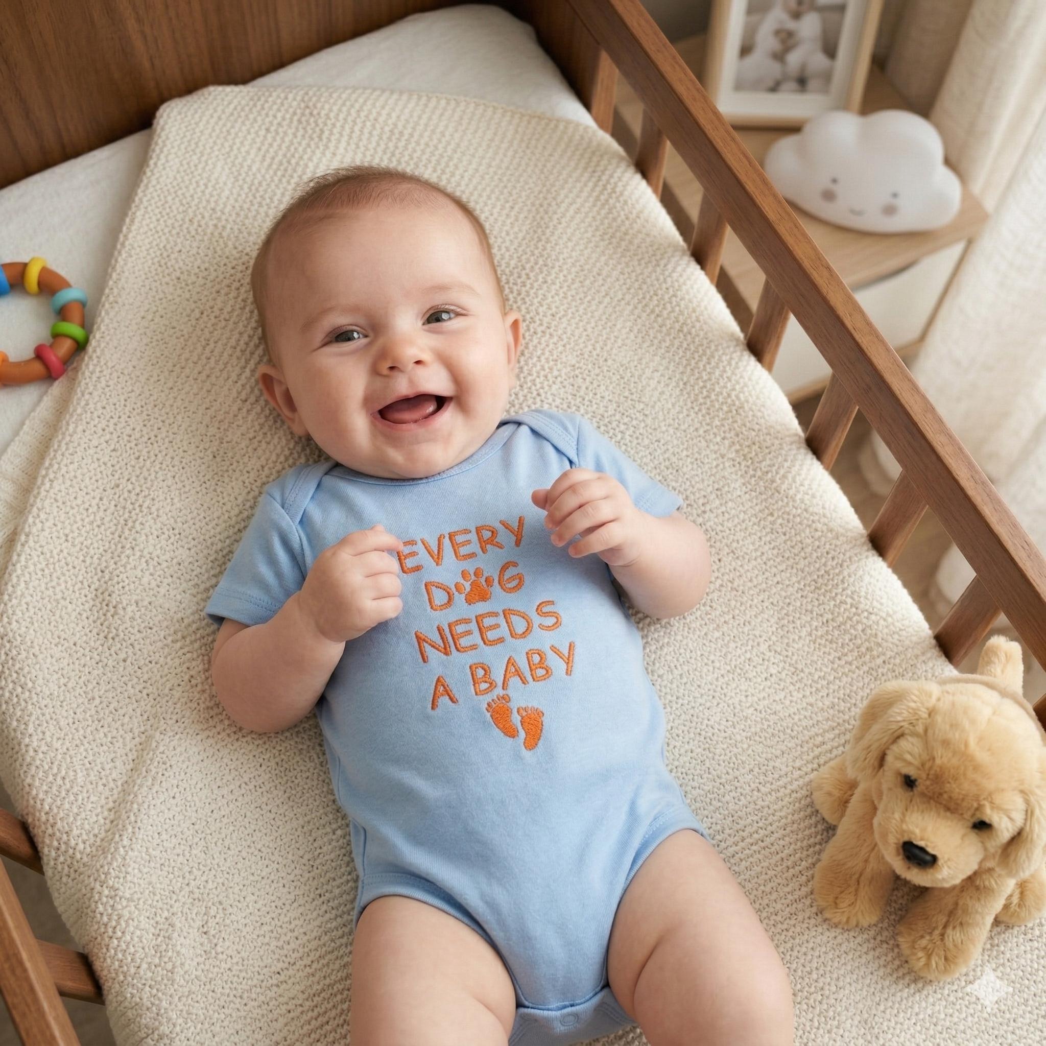 Every Dog Needs A Baby Embroidered Onesie