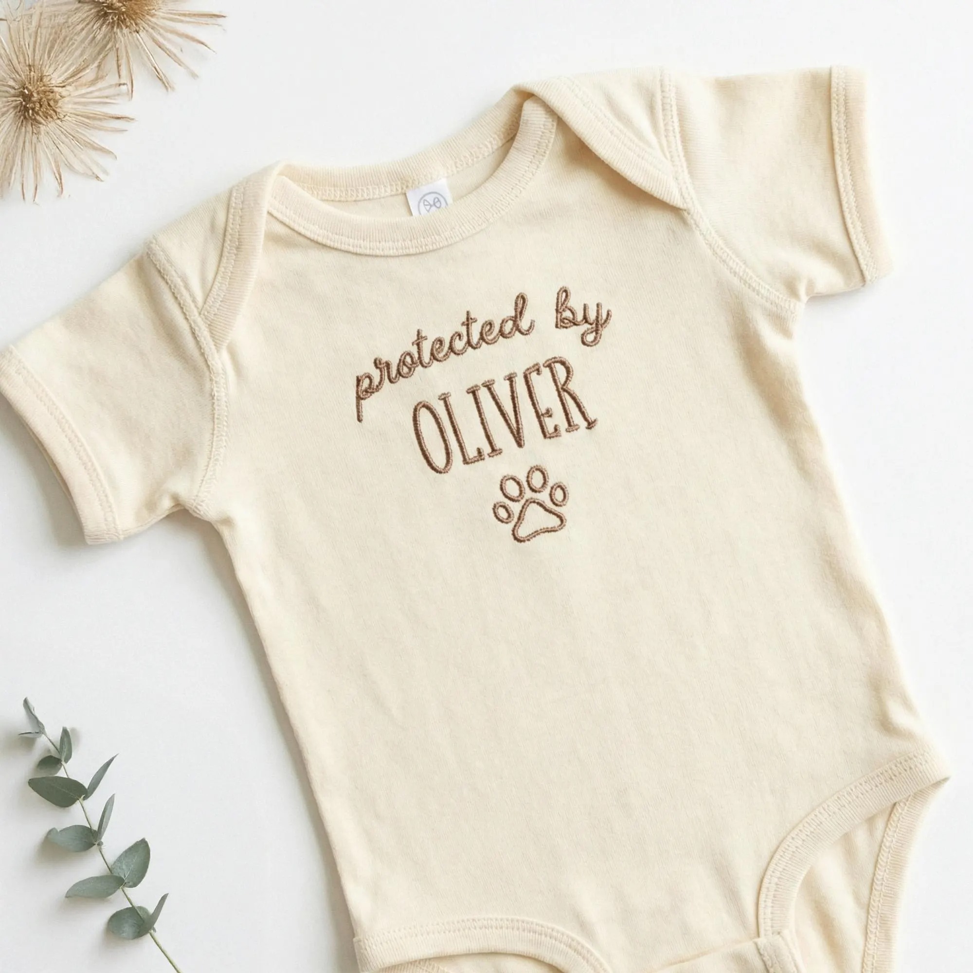 Protected by Baby Onesie - Custom Embroidered Pet Name Onesie