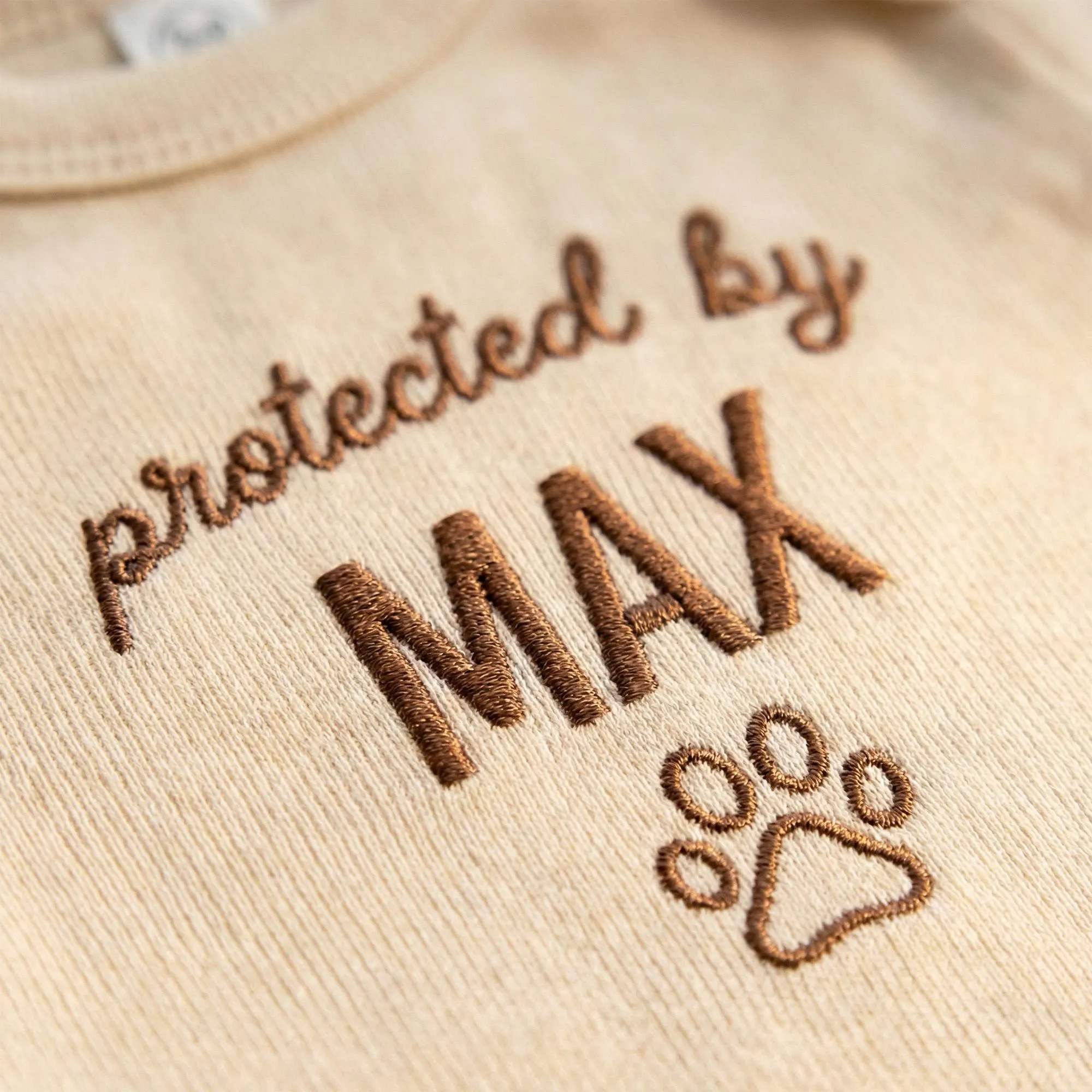 Protected by Baby Onesie - Custom Embroidered Pet Name Onesie