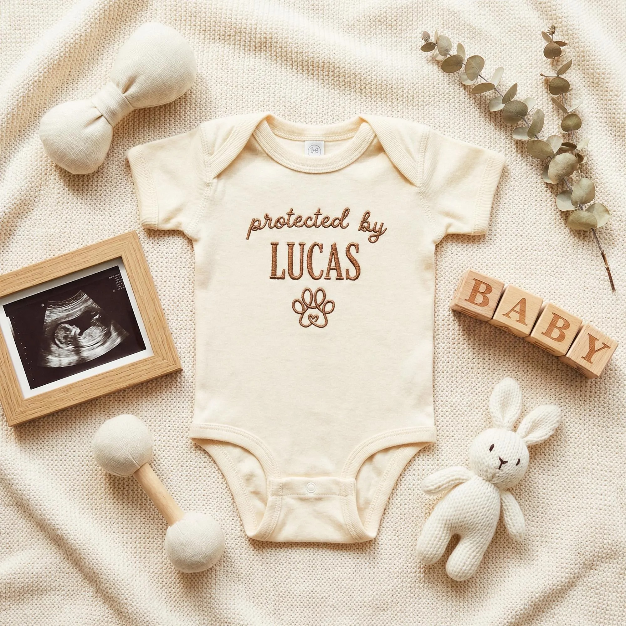 Protected by Baby Onesie - Custom Embroidered Pet Name Onesie