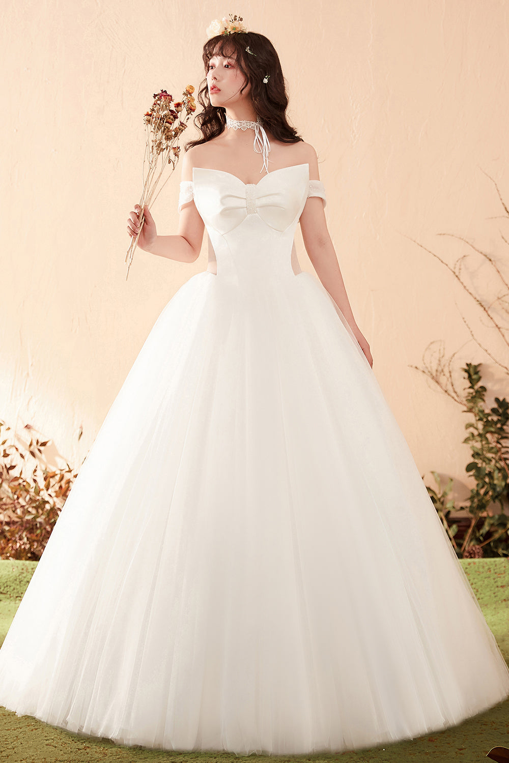 Elegant Off-Shoulder Ball Gown Wedding Dress with Statement Bow