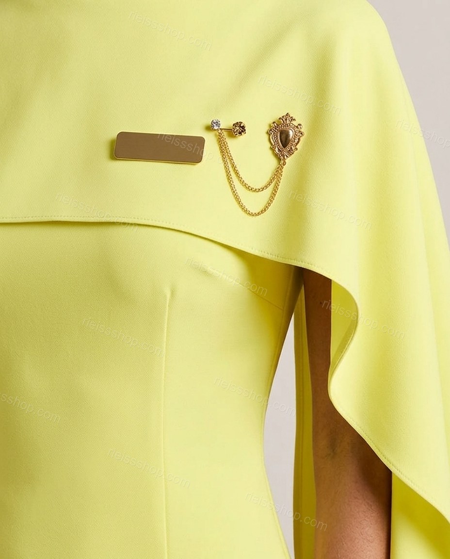 Lime Yellow Maxi Cape Dress, close-up of attached cape overlay, flared hem and decorative brooches, by Rieissshop