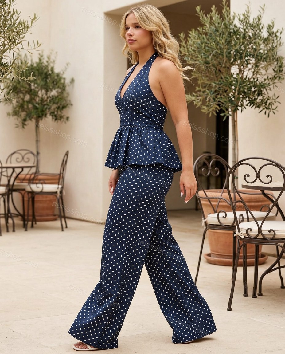 Navy Polka Dot Halter Peplum Jumpsuit, walking lifestyle view, by Rieissshop