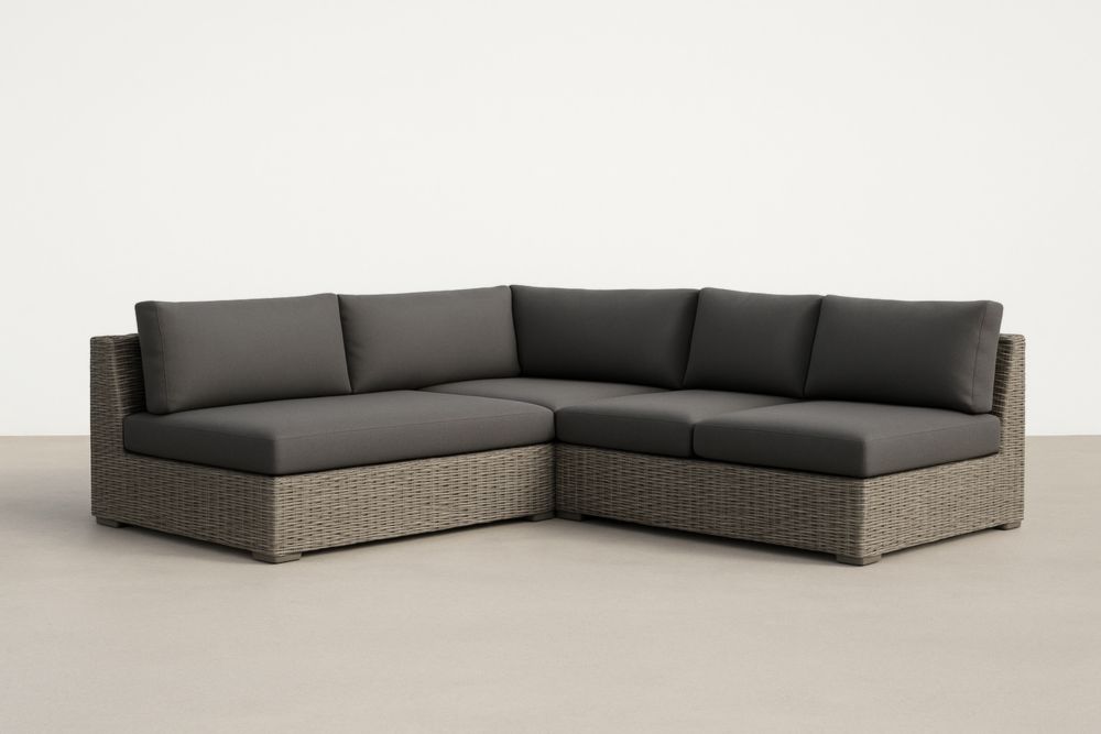 Divano angolare in rattan con cuscini grigi