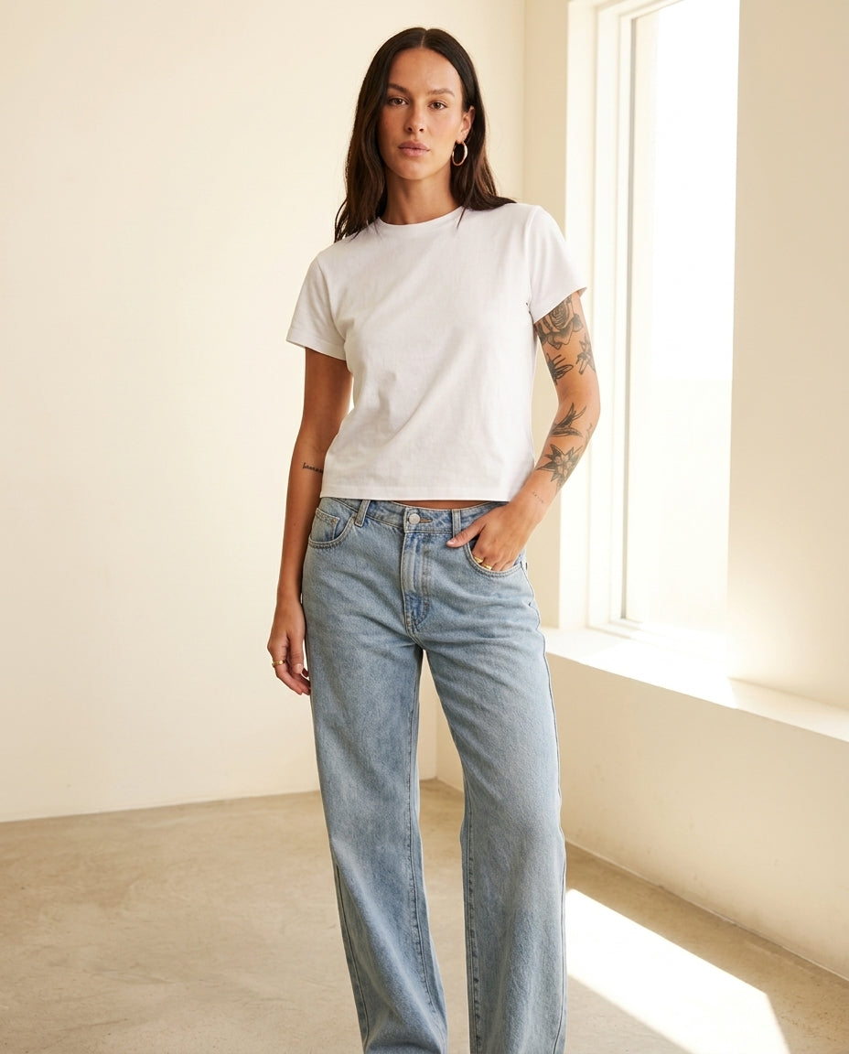 Light Wash Denim Bloom Summer Lace Romper Light Wash Denim Romper with Wide-Leg silhouette and Textured texture, front view product image for Wedding Guest, an estate dinner at golden hour, US East / Hamptons Elite by Mesadic